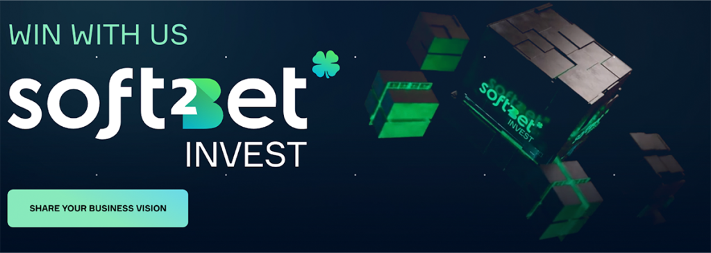 Soft2Bet Invest promotional banner with slogan “Win With Us” and a call-to-action button saying “Share Your Business Vision”
